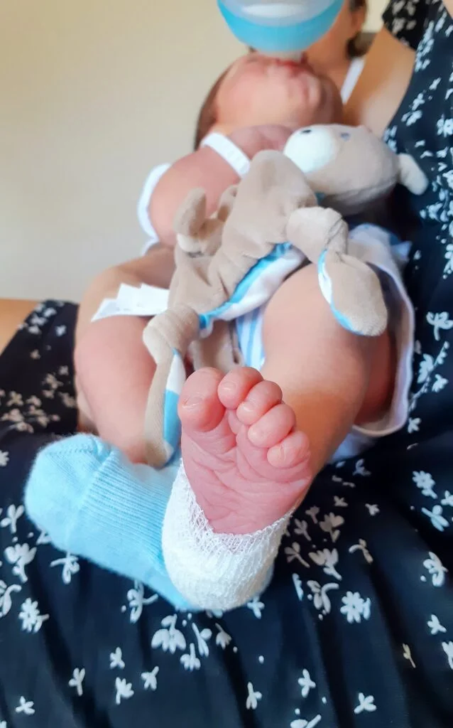 Detail of the foot of a medicated newborn after a blood draw from the heel.